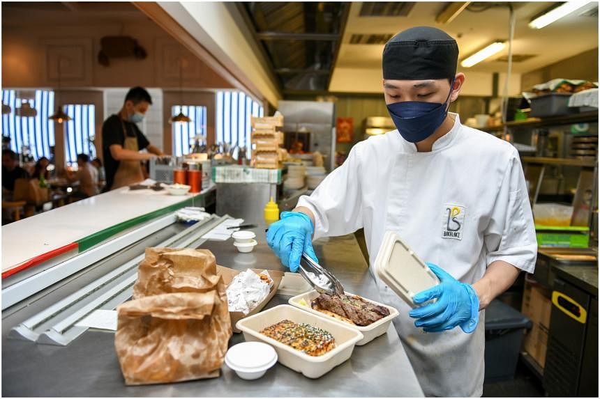  Customers made twice as many food delivery orders a month in 2021 compared to 2019. ST PHOTO SHINTARO TAY 