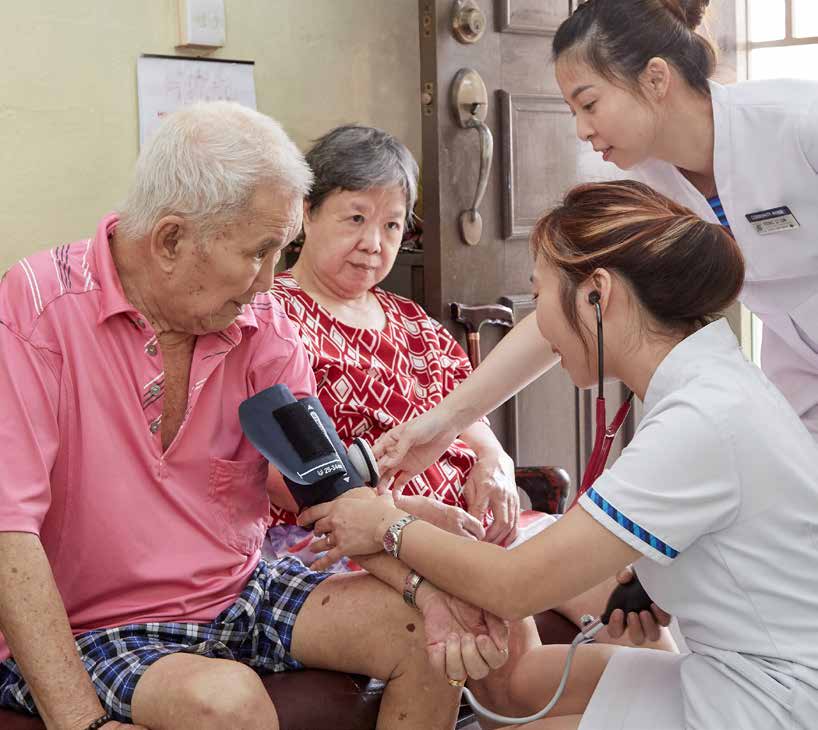  ​During home visits, Community Nurses Ms Jovin Ang (left) and Ms Yiong Li Lin check Mr Leong Hoong Tan’s blood pressure, while his sister, Mdm Leong Yoke Hing, looks on.