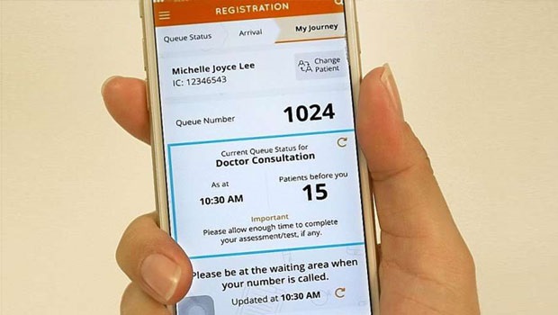  ​​SingHealth's Health Buddy mobile app allows patients to check in at clinics remotely and gain real-time updates on their queue status without having to spend a long time waiting in line. The service was started in response to demand from patients.  ST PHOTO JONATHAN CHOO